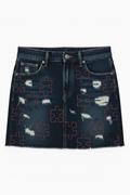 U.D.F Distressed Dark Denim Mini Skirt - Front heavily distressed with scattered black and red puzzle pieces